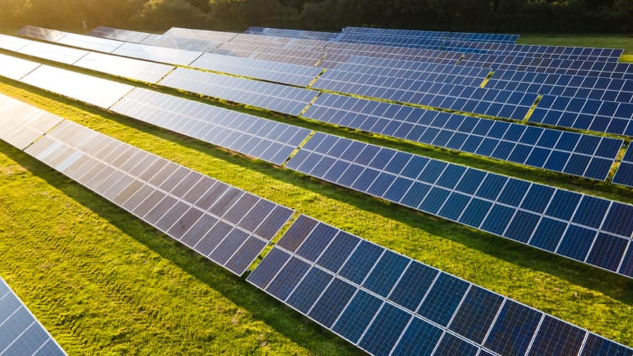 Solar panel array in a green field